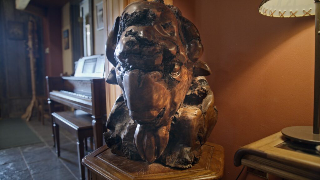 Photo of American Bison carved out of wood at Ringnecks Lodge.